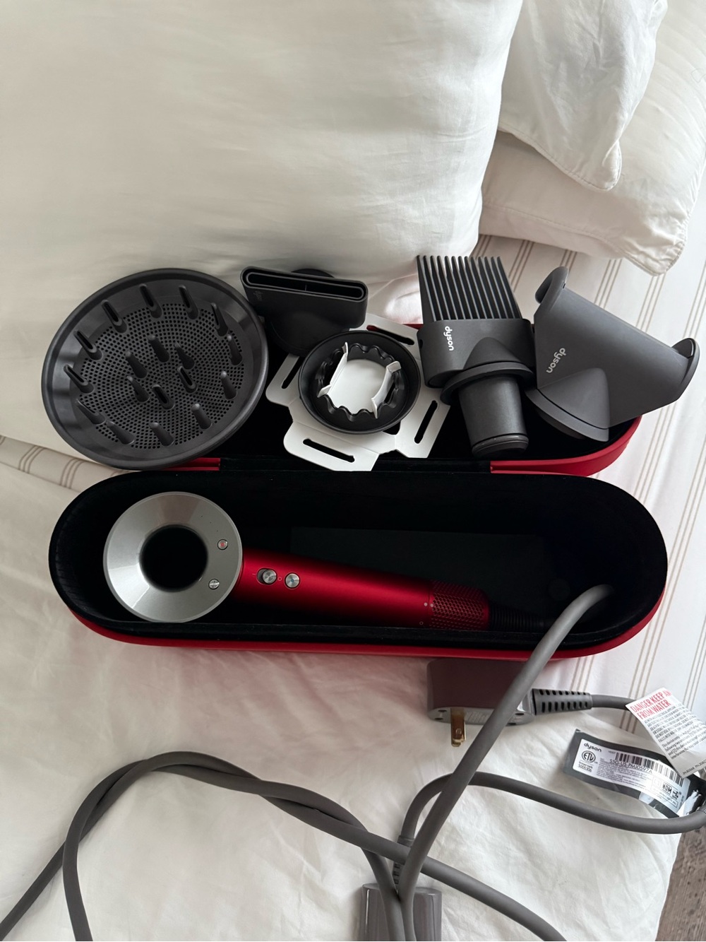 Dyson Hair Dryer with Red and Silver Accessories